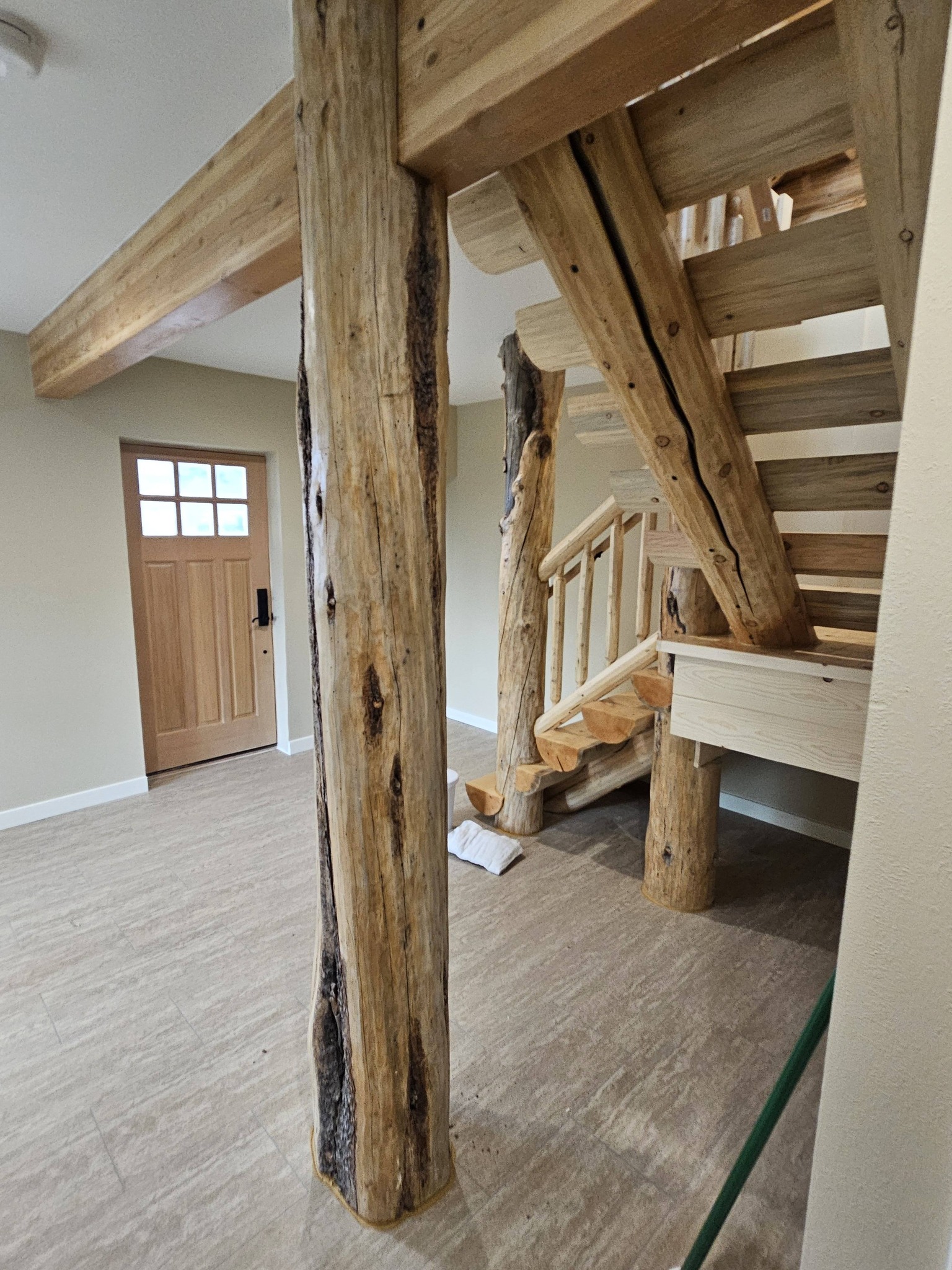 Custom log staircase with natural character